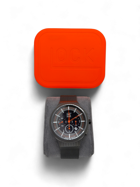 Original Glock Uhr Global mit orangem und schwarzem Mesh Band im orangen Glock Case