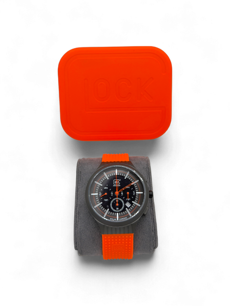 Original Glock Uhr Global mit orangem und schwarzem Mesh Band im orangen Glock Case