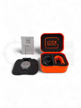 Original Glock Uhr Global mit orangem und schwarzem Mesh Band im orangen Glock Case